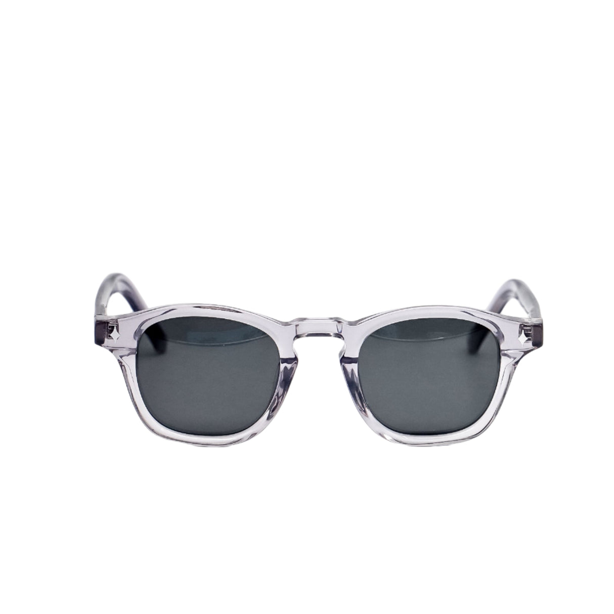 Sunglasses with clear frame and dark lenses on a white background