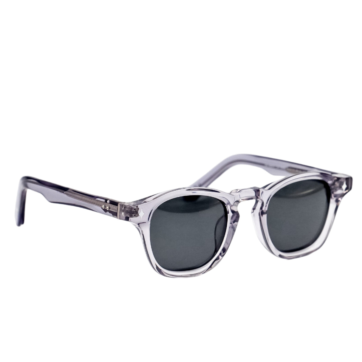 Sunglasses with clear frame and dark lenses on a white background