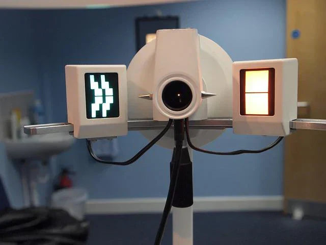 The machinery with digital screens and a lens for diagnosing eye problems