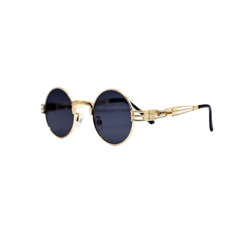 Gold-framed sunglasses with black lenses on a light gray background