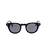 Black sunglasses with dark lenses on a white background