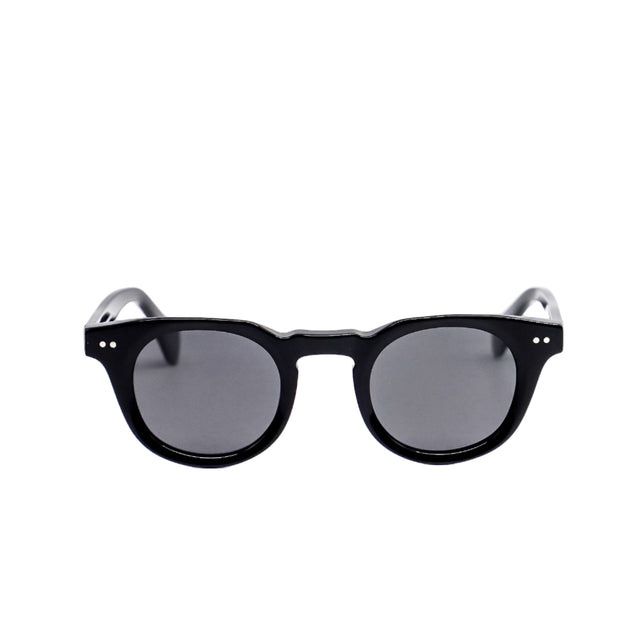 Black sunglasses with dark lenses on a white background