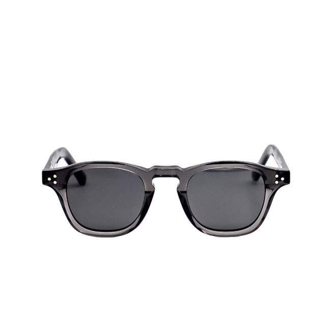 Sunglasses with dark lenses and thin frames on a white background