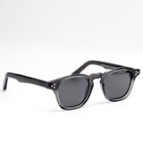 Black sunglasses with dark lenses on a white background