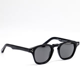 Black sunglasses with dark lenses on a white background