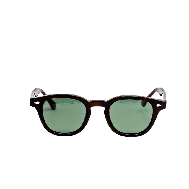 Sunglasses with green lenses and dark brown frame on a white background